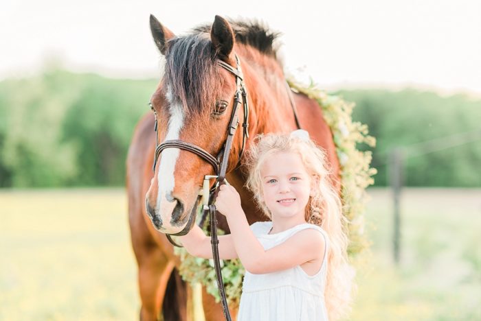 girl and her pony with a flower garland equine portrait photography