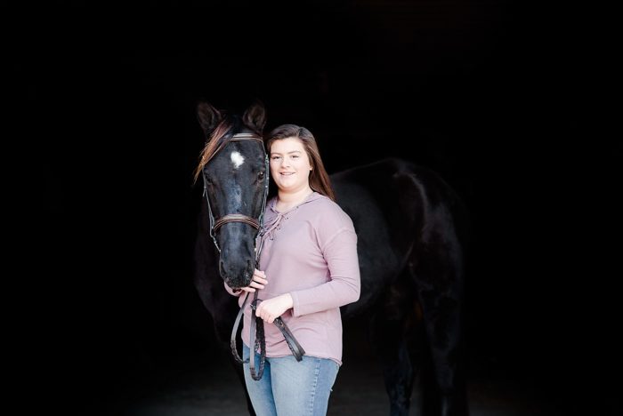 girl and horse with black background